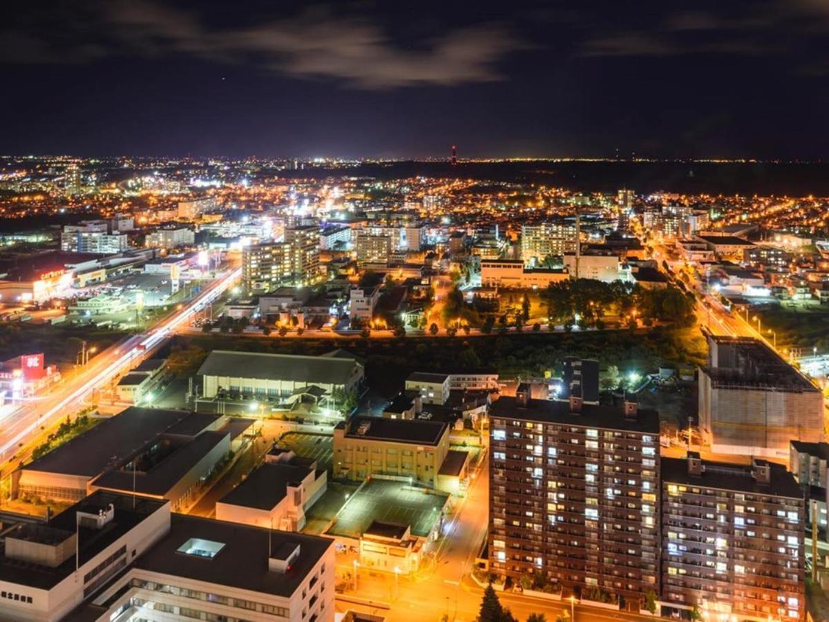 Hotel Emisia Sapporo Eksteriør bilde Aerial view of the city at night
